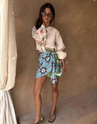 Never Fully Dressed Minigonna avvolgente blu con stampa multicolore