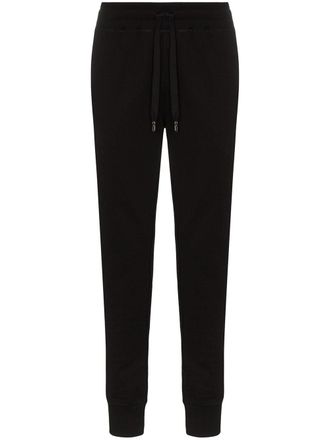 Dolce & Gabbana logo-tag track pants - men - Cotton - 46 - Black