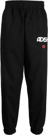 Adish Zahara logo-print track pants - men - Cotton - L - Black