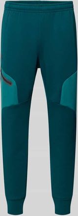 Under Armour Regular Fit Sweatpants mit Logo-Print Modell Unstoppable in Petrol, Gr&ouml;&szlig;e XXL