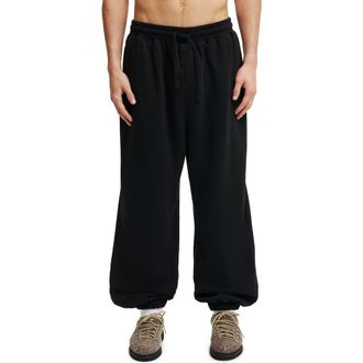 Cotton On Mens Super Baggy Cuffed Track Pant in Black at Nordstrom, Size X-Large