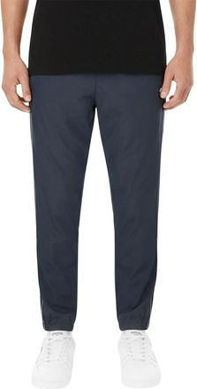 Lacoste Joggingbroek voor heren met zijstrepen, elastische tailleband en taps toelopend model (Zwart)