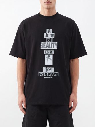 Balenciaga T-shirt in cotone con stampa slogan e spalle cadute