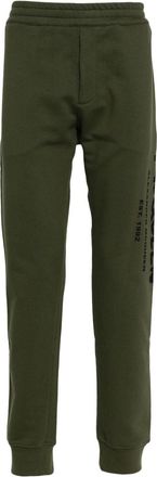 Alexander McQueen logo-print track pants - men - Cotton/Cotton - M - Green