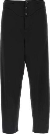 Saint Laurent Zijden Broek met Plooi en Knoopsluiting van Saint Laurent - Heren - Straight fit broeken - Zwart - XL - Satijn - Broeken