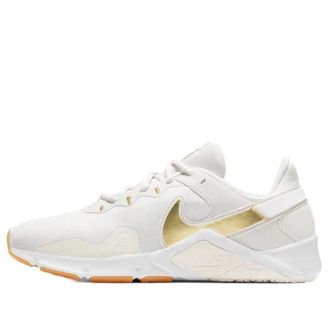Nike Womens Legend Essential 2 Sneakers In White/golden