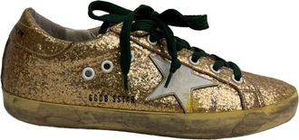 Golden Goose Super Star Low-Top Sneakers in Metallic Gold Glitter