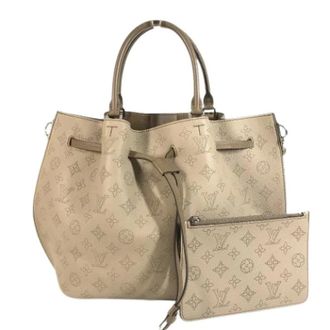 Louis Vuitton Pre-owned Bucket Bags, female, Beige, Size: ONE SIZE Pre-owned Mahina Leather Bucket Bag