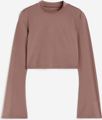 H&M Cropped Sportshirt aus SoftMove - Beige