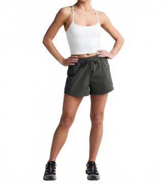 Beyond Yoga Peak Mid Rise Shorts In Slate Green