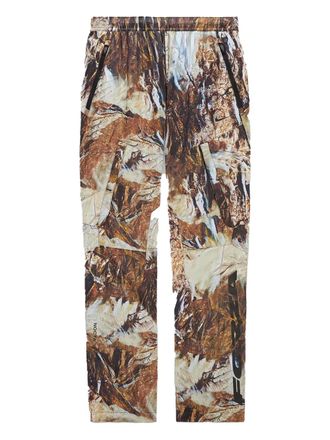Nike camo-pattern performance trousers - men - Polyester - L - Neutrals