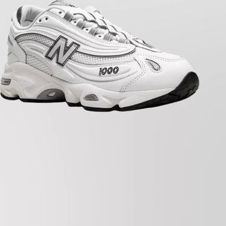 New Balance lace-up sneakers with mesh panels and rubber sole