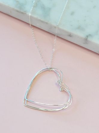 A Blonde and Her Bag Silver Hearts Necklace on a Silver Chain