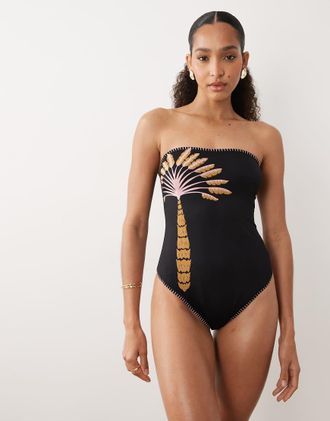 Never Fully Dressed Costume da bagno a fascia decorato nero con stampa di palme