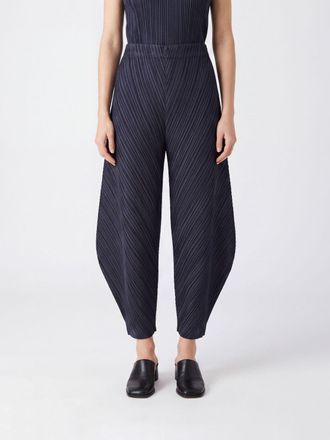 Pleats Please Issey Miyake Pantaloni cropped a gamba larga in cr&ecirc;pe plissettato