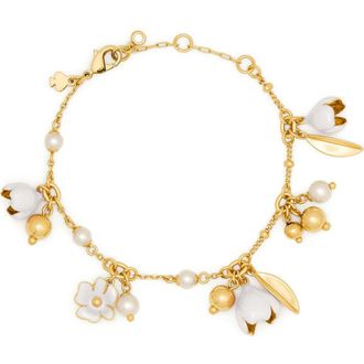 Kate Spade New York golden bloom flower charm bracelet in White. at Nordstrom