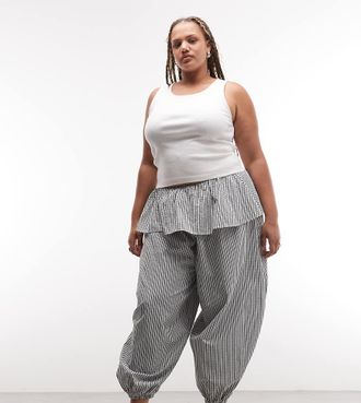 Asos Curve ASOS DESIGN Curve - Pantaloni a palloncino con gonna sovrapposta a quadri bianchi e neri-Multicolore