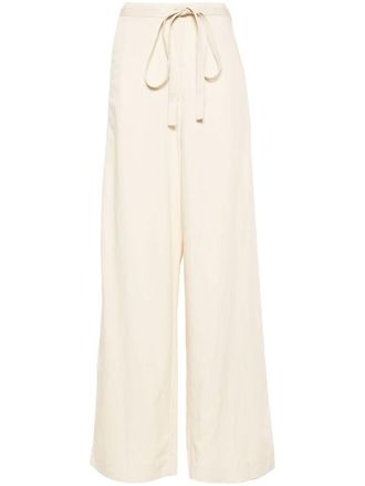 Toteme belted-waist flared trousers - Neutrals