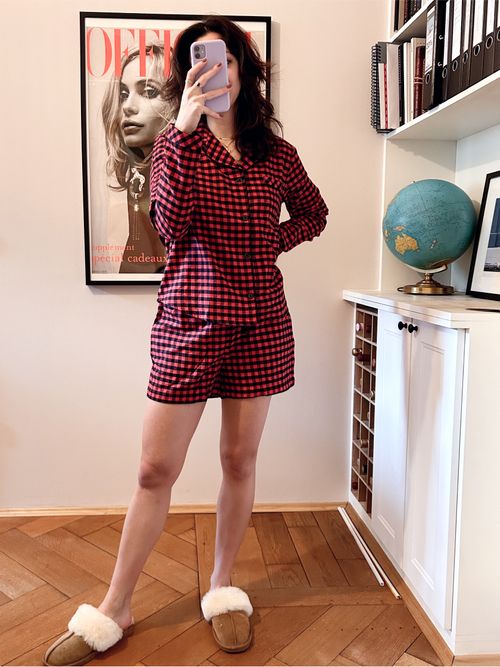 Our style editor wears a black and red flannel pajama set