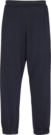 Balmain monogram-pattern elasticated-waistband track pants - men - Viscose/Elastane/Polyamide - 50 - Blue