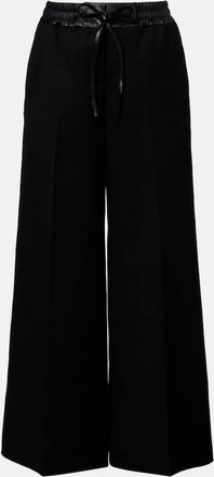 Alaia Ala&iuml;a Pantalones anchos de lana virgen con piel