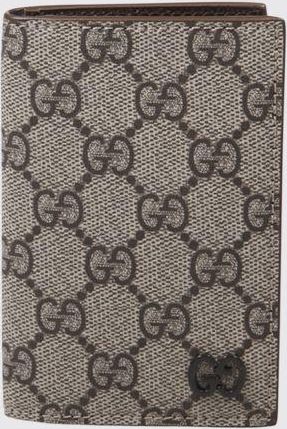 Gucci Portacarte bifold in tessuto GG Supreme con dettagli in pelle