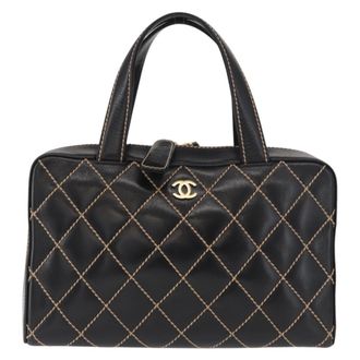 Chanel Surpique Boston Quilted Leather Black Leather Handbag (Pre-Owned)