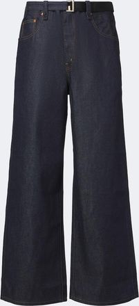 sacai Jeans anchos con cintur&oacute;n