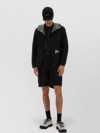 And Wander hooded three layer jacket long sleeves pockets