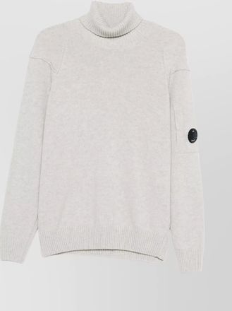C.P. Company wool turtleneck sweater featuring arm patch