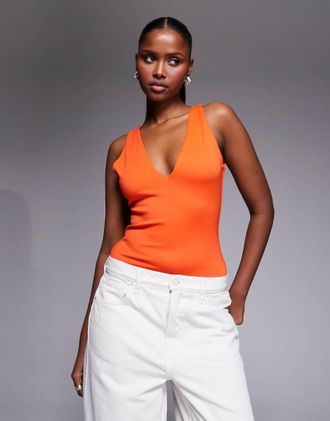 Good American Body arancione acceso con scollo profondo a V