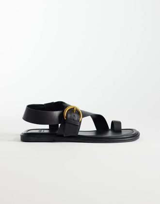 schuh Tanvi - Sandali infradito in pelle nera con cinturino alla caviglia e fibbia-Nero