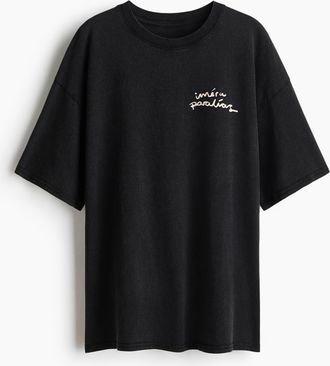 H&M Oversized T-Shirt mit Motivprint - Schwarz/Im&eacute;ra Paral&iacute;as