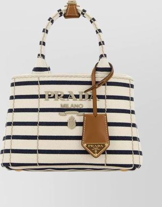 Prada mini handbag with striped design and tag
