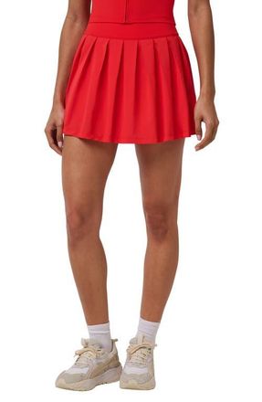 Travis Mathew Breezeblend Court Pleated Performance Miniskirt in Tomato at Nordstrom, Size Xx-Large