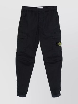 Stone Island cargo pants with snap button pockets