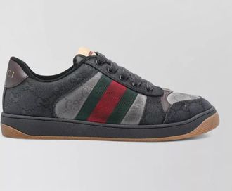 Gucci round toe sneakers featuring rubber sole and stripes