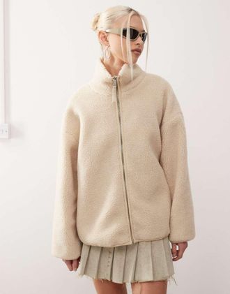 Monki long sleeve zip through fleece with contrasting trims in off white with pink floral lining-Multi