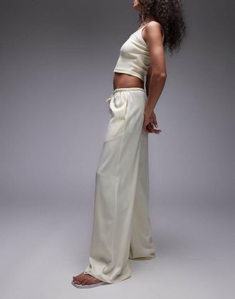 Topshop Pantaloni allacciati in vita a fondo ampio in raso color latticello-Neutro