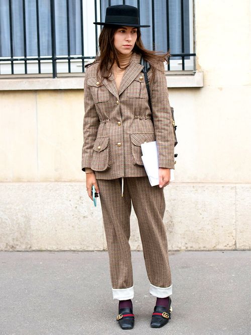 Editor in chief of L’official Ukraine Ulyana Boyko wears a Flow the label suit, Dior hat, Gucci shoes day 2 of Paris Womens Fashion Week Spring/Summer 2018, on February 27, 2018 in London, England.