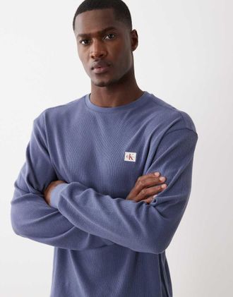 Calvin Klein Jeans Maglietta a maniche lunghe blu a nido dape con stemma