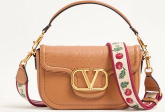 Valentino Garavani Valentino Garavani Alltime shoulder bag in grainy calfskin with Cherryfic embroidered ribbon shoulder strap. Wo