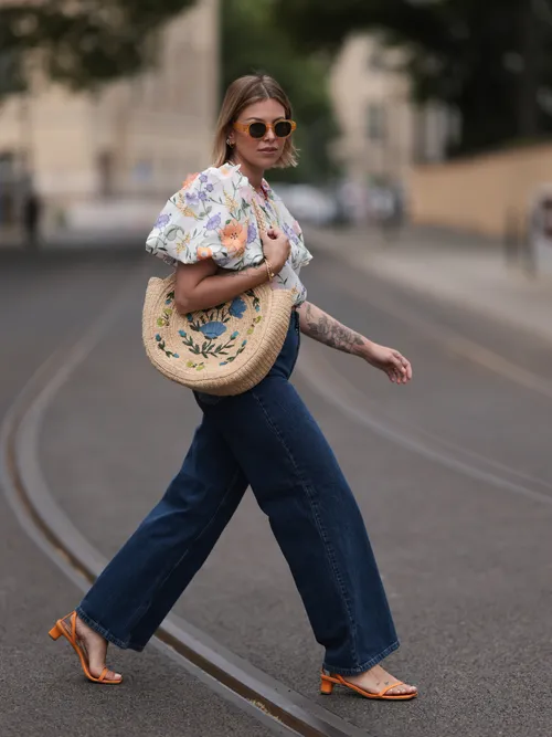 A guest wears Baum und Pferdgarten jeans, Mango sandals, and a top from & Other Stories