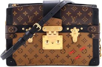 Louis Vuitton Trunk Reverse canvas clutch met monogram - Bruin