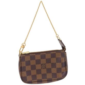 Louis Vuitton Pre-owned Handbags, female, Brown, Size: ONE SIZE Pre-owned Canvas clutches