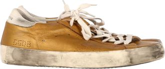 Golden Goose Superstar Perforated Sneakers in Gold Leather