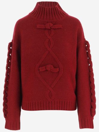 The Garment De kledingstukwol- en kasjmiertrui met strikken en vlechten