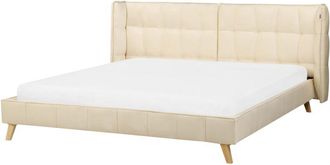 Beliani Cama tapizada en terciopelo beige con patas de madera clara 180 x 200 cm somier con listones cabecero con alas ajustables Senlis