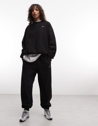Nike Studio - Joggers oversize in pile pesante neri-Nero