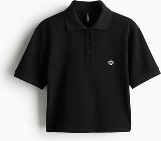 H&M Kurzes Poloshirt aus Pikee - Schwarz